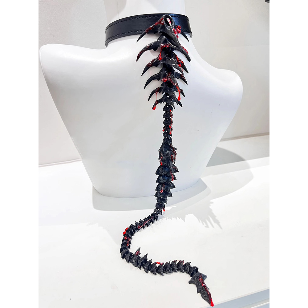Black and red spiked choker on a mannequin bust