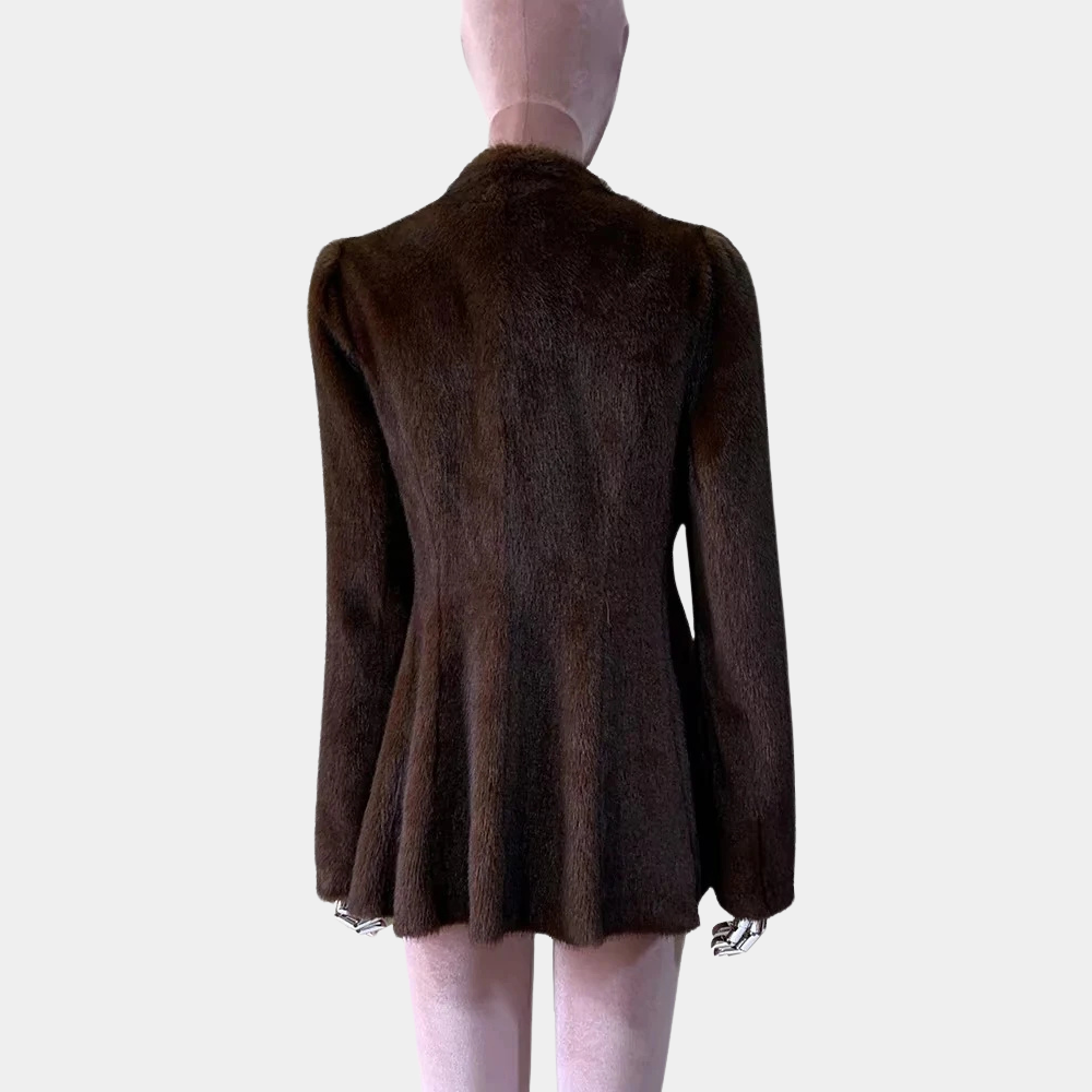 Brown jacket on a mannequin against a plain background