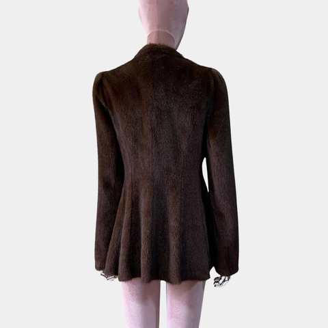 Brown jacket on a mannequin against a plain background