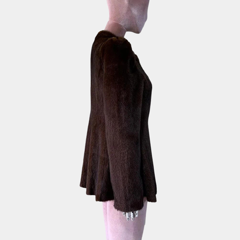 Brown textured skirt worn by a person on a plain background